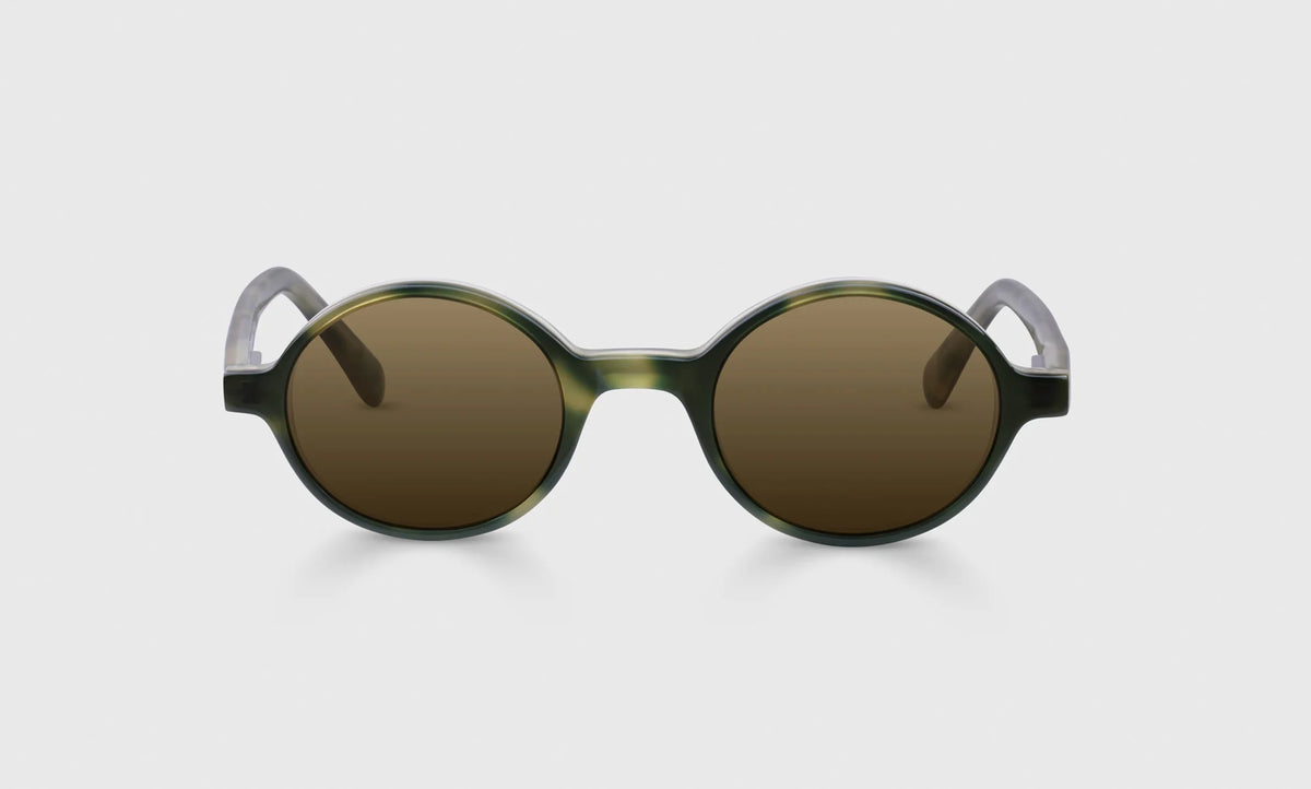 P. Body Round Acetate Sunglasses – Milky Black and Amber on-face view | Buena Vision Optometry